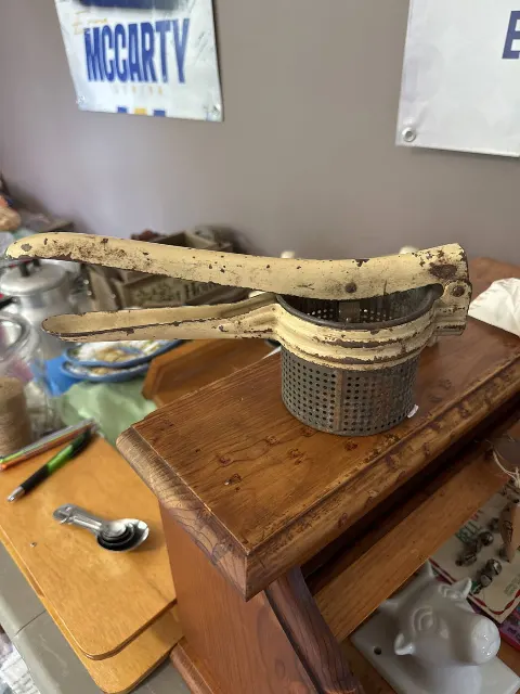 Yellow potato masher